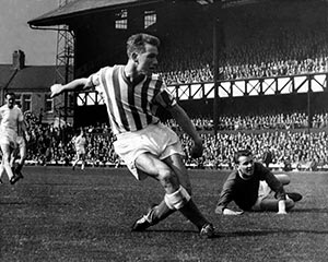 In their playing days - Clough (for Sunderland) scores while Revie (Leeds) looks on in the background
